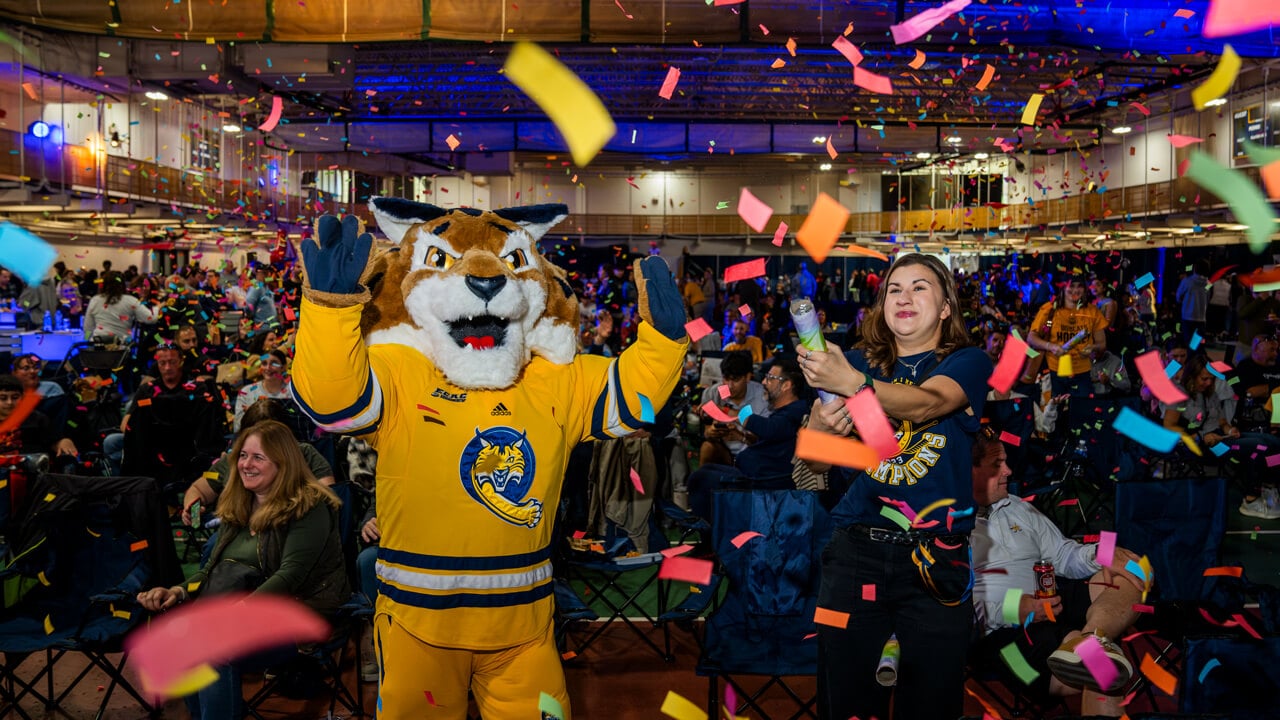 Boomer the Bobcat mascot with confetti
