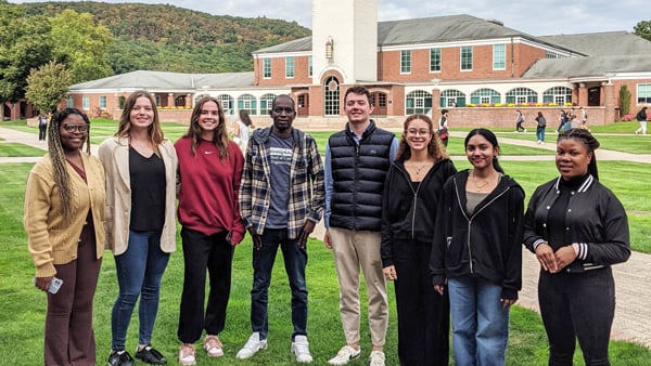 Members of the International Student Advisory Board pose for a photo on the quad